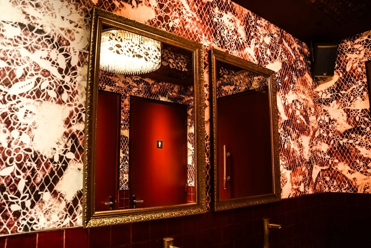 Ornate mirrors and deep red details inside Ntourage
