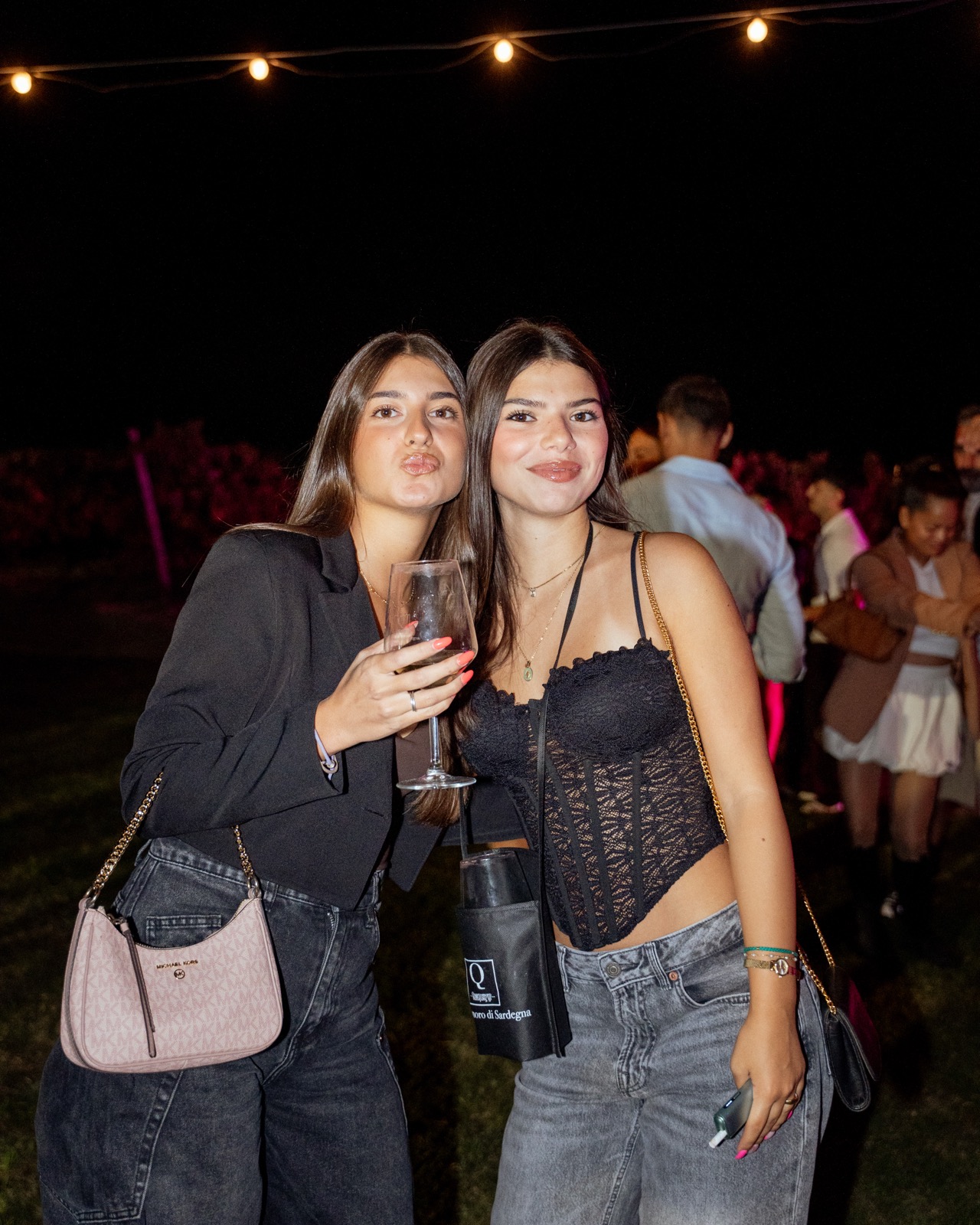 Two guests with wine at an earlier Quartomoro gathering