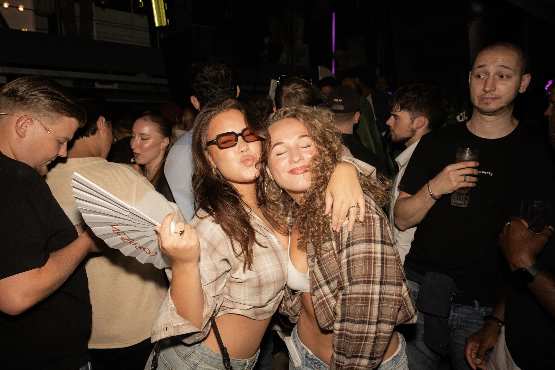 Two Sunset Cruise guests embracing in the crowd