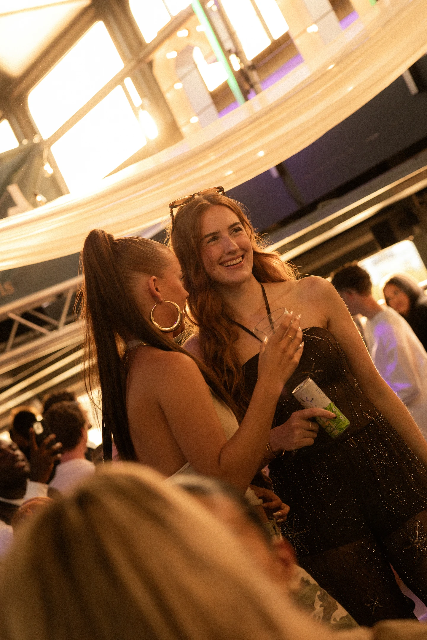Friends sharing a laugh aboard the Sunset Cruise