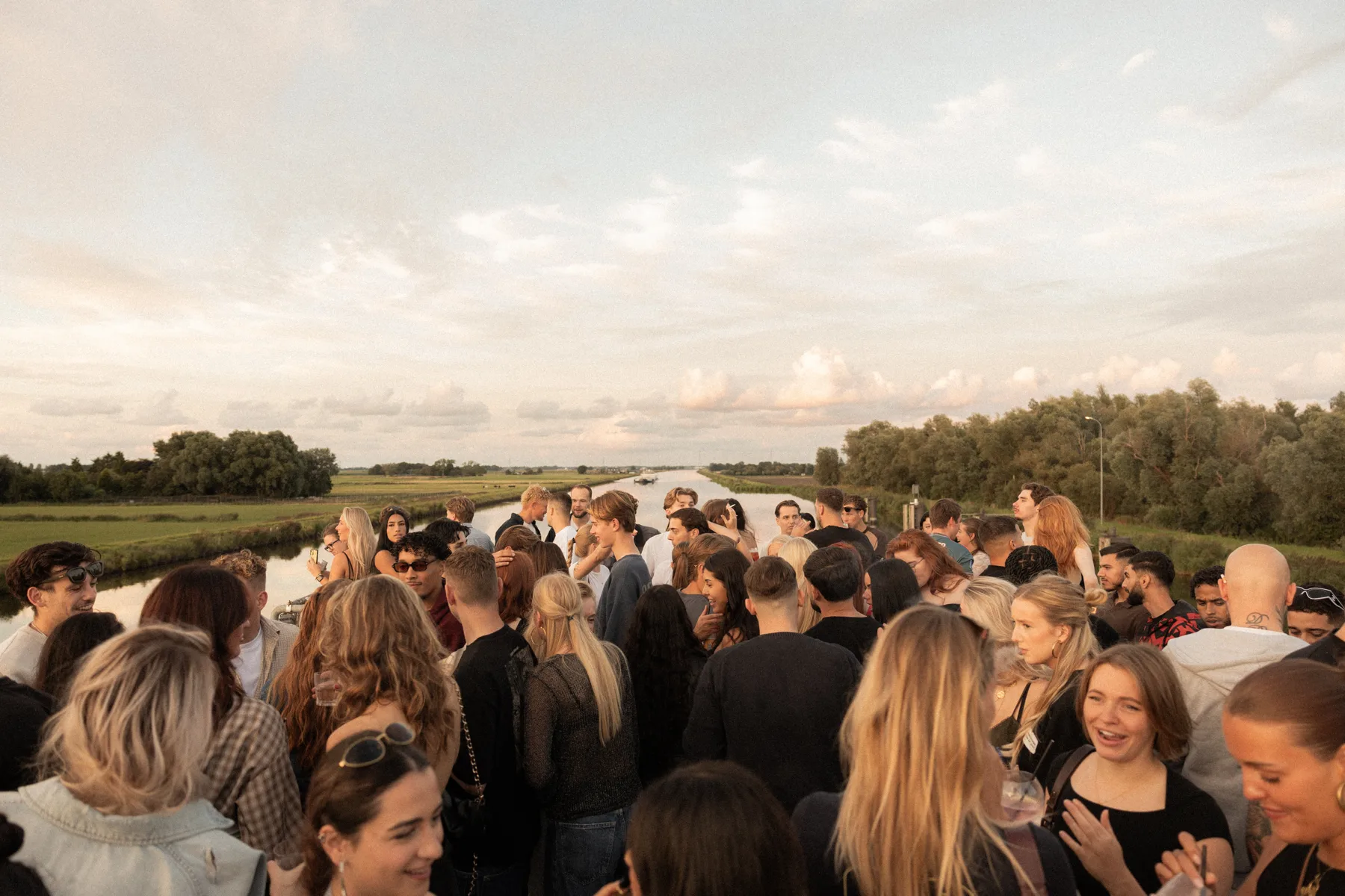 Sunset Cruise guests beside the Groningen landscape
