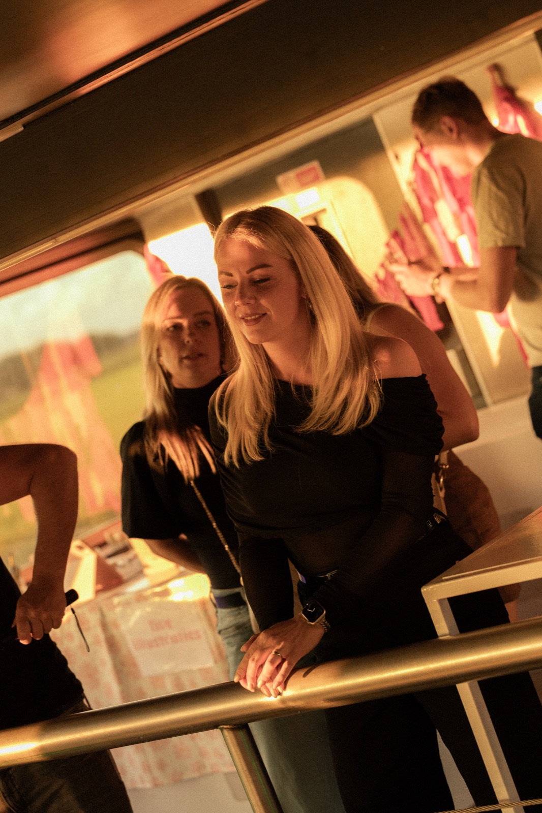 A guest in the warm interior of the Sunset Cruise